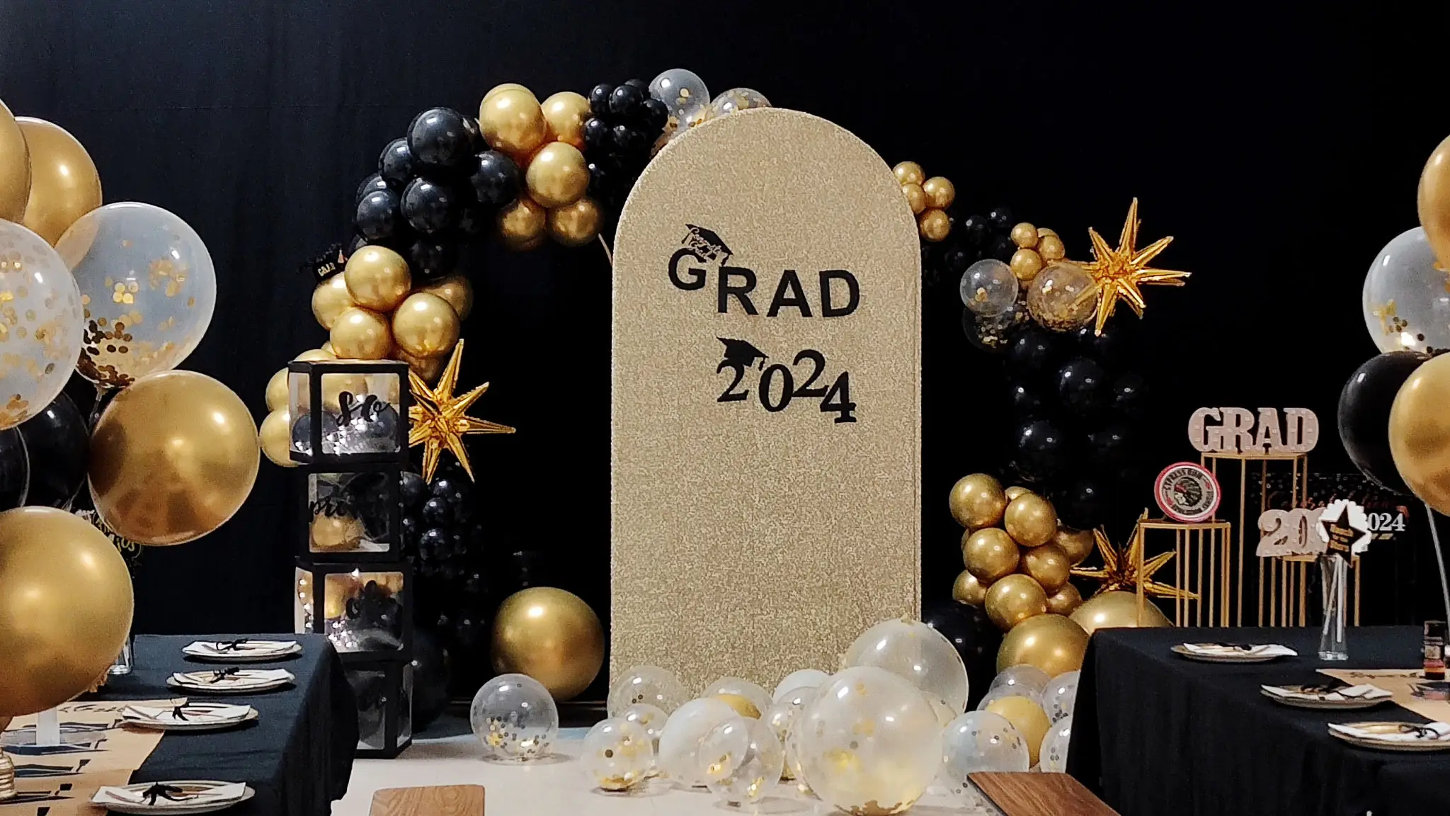 Black and gold 2024 graduation party setup